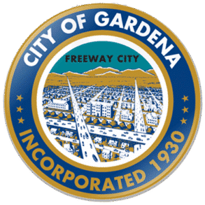 City of Gardena emblem, "Freeway City, Incorporated 1930," features cityscape and mountains.